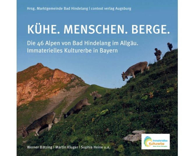 KÜhe. Menschen. Berge